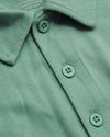 Light Heather Greenery Classic Polo with three-button placket and soft tag.
