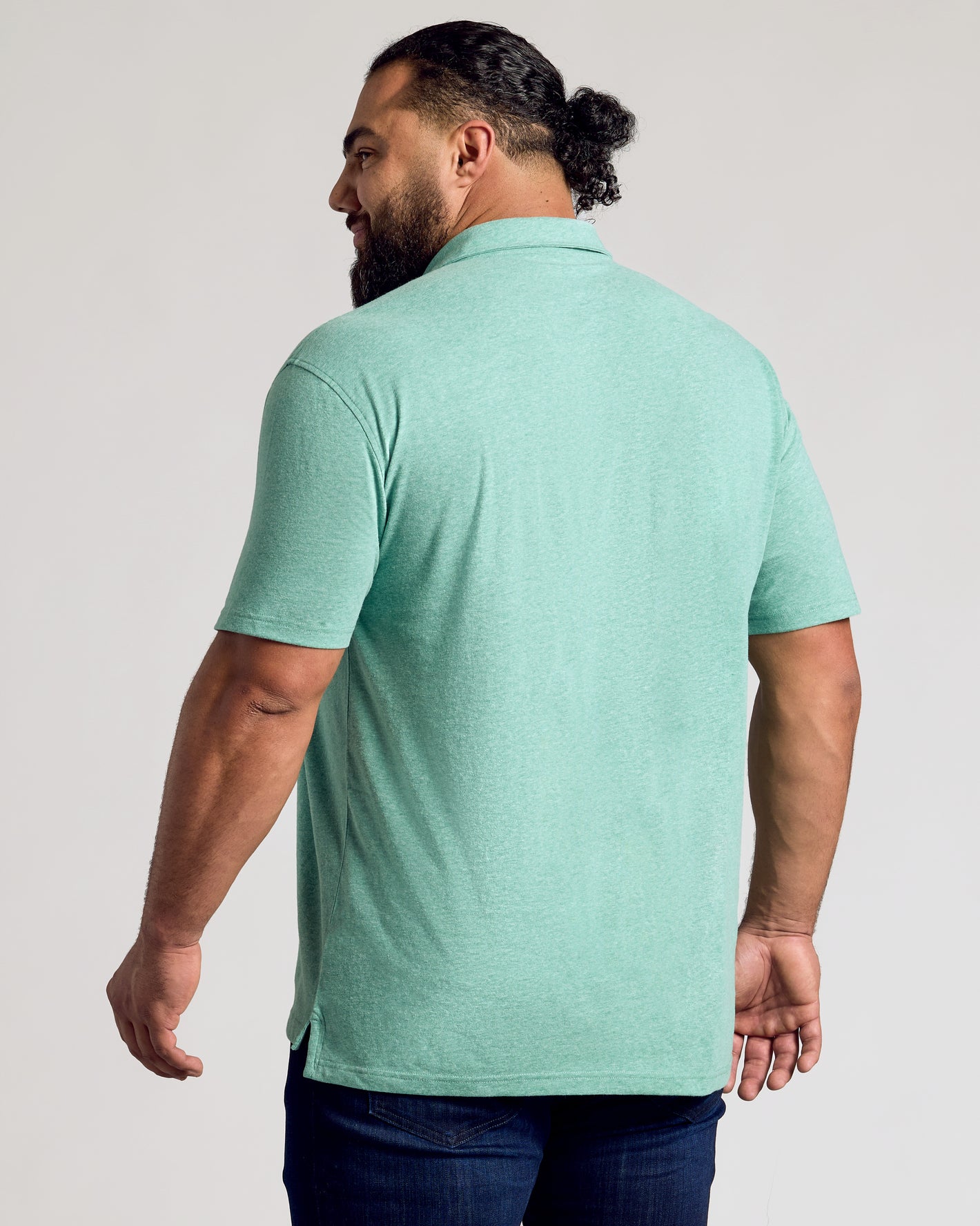 Back view of man in Light Heather Greenery Classic Polo.