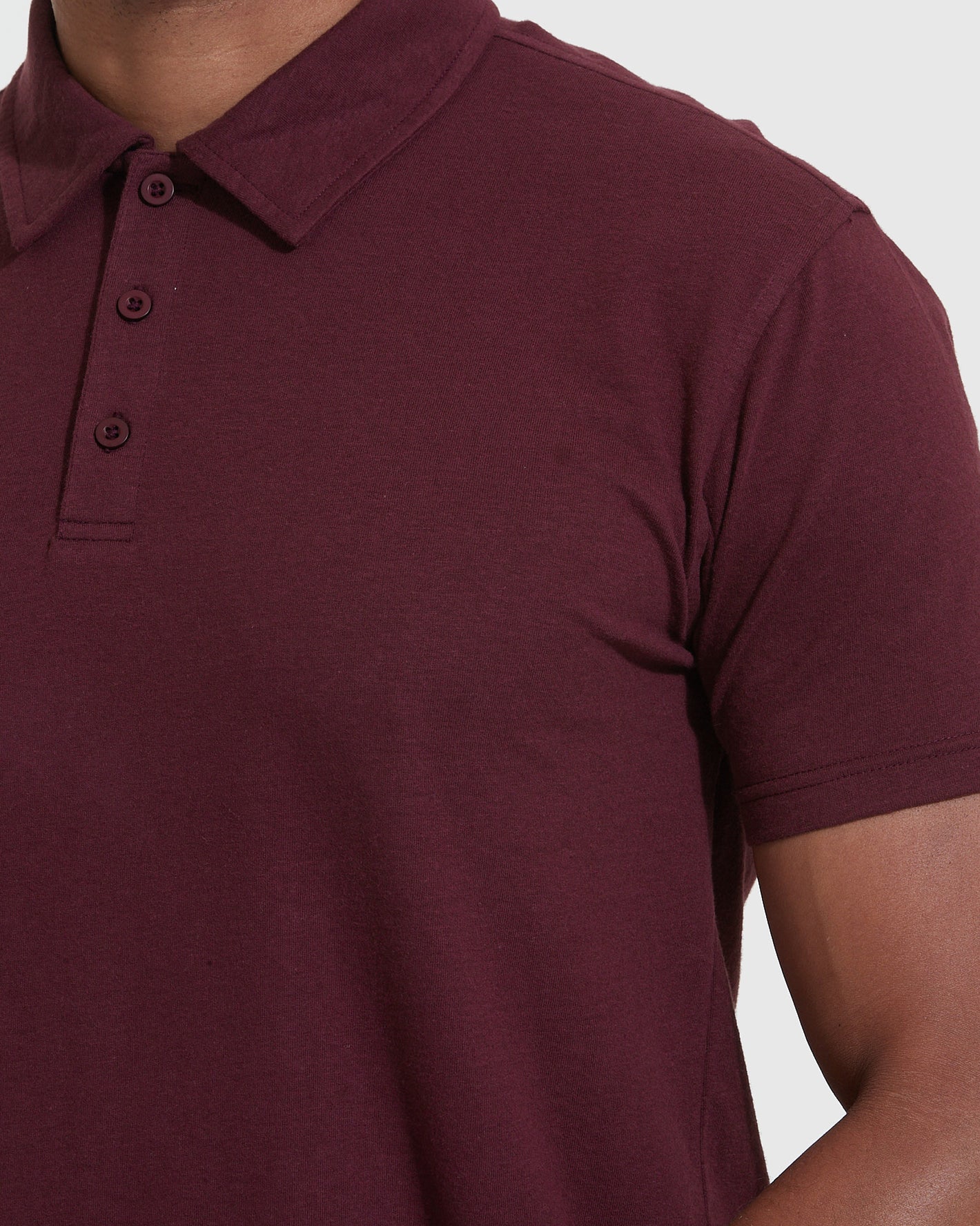 Mahogany Polo with three-button placket and folded collar.
