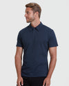 Model in All Navy Short Sleeve Polo 6-Pack, relaxed pose.