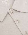 Oatmeal Classic Polo with folded collar and buttoned placket.