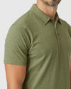 Man wearing Olive Green Heather Polo, showcasing its short sleeves and fitted design.