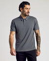 Man modeling The Essentials Classic Polo 3-Pack in gray.
