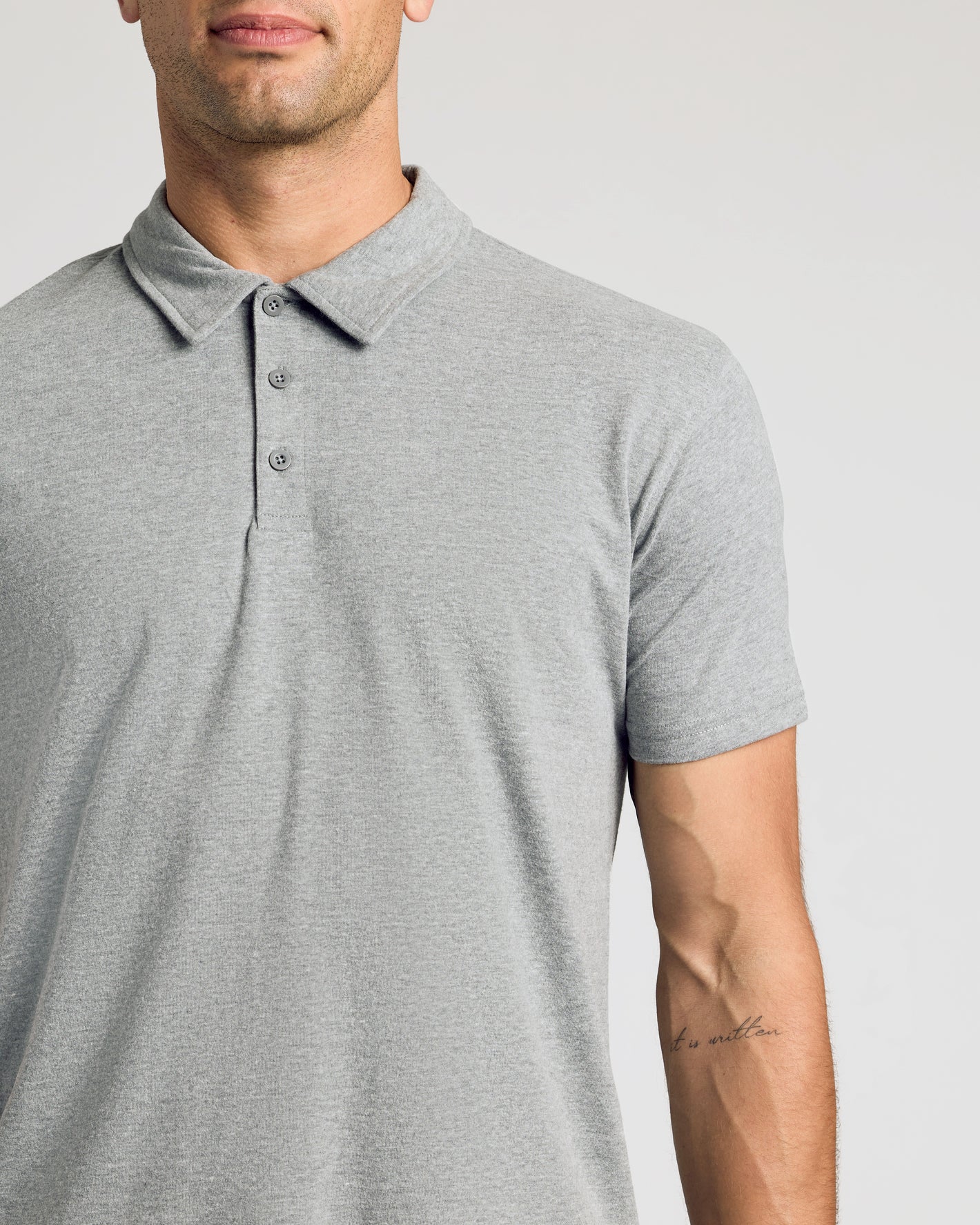 Person wearing The Light Indigo Short Sleeve Polo from 3-Pack.