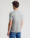 Man wearing Wardrobe Classic Polo, light gray, short-sleeve, back view.