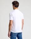 Man wearing All White Classic Polo from 10-Pack, back view.