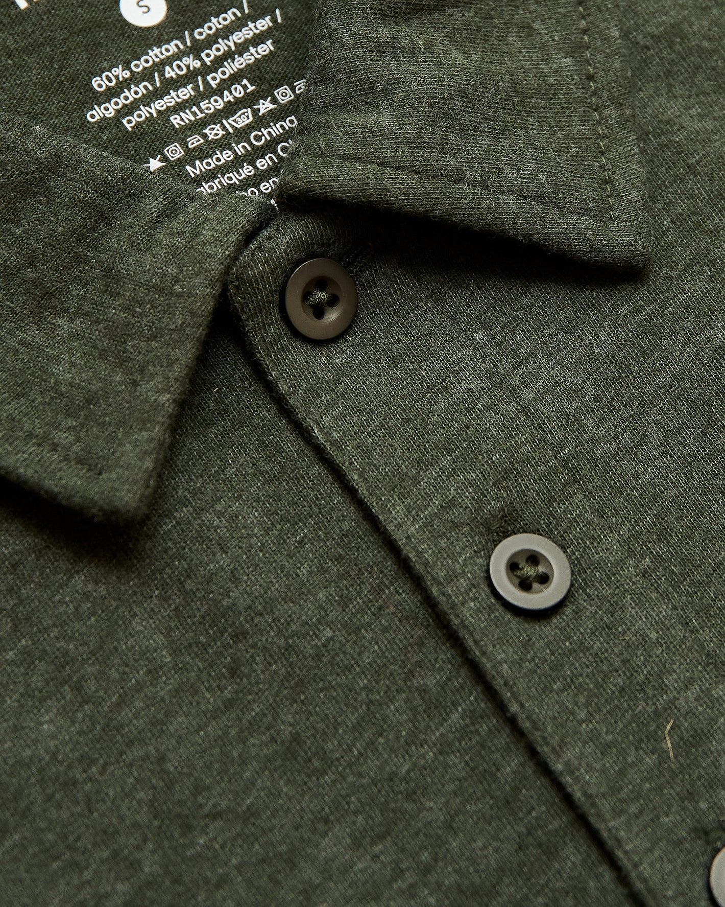 Racing Green Heather Polo with folded collar and button placket.