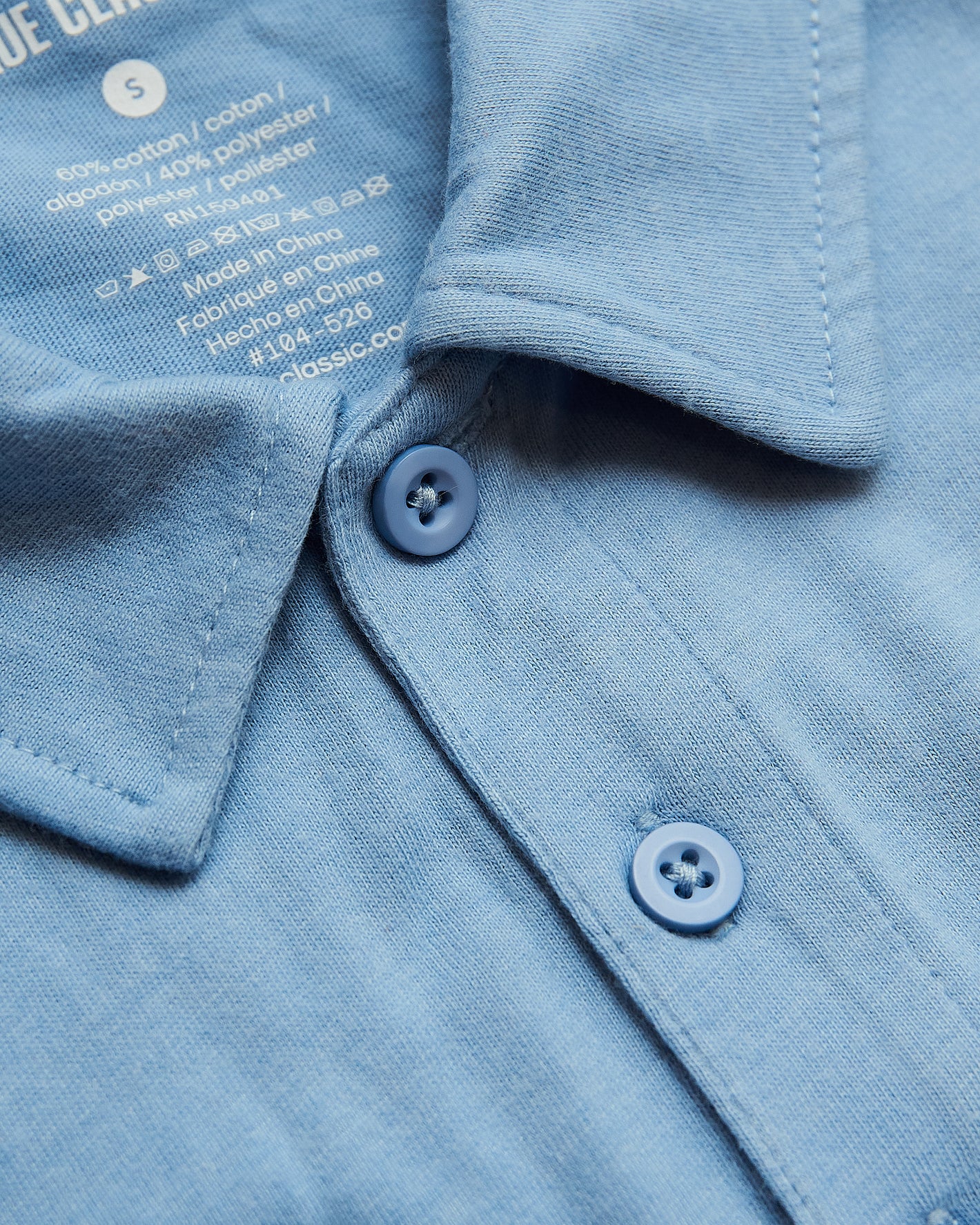 Sky Blue Heather Polo showcasing collar and button placket details.