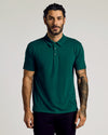 Viridian Classic Polo worn by tattooed man, neutral expression.
