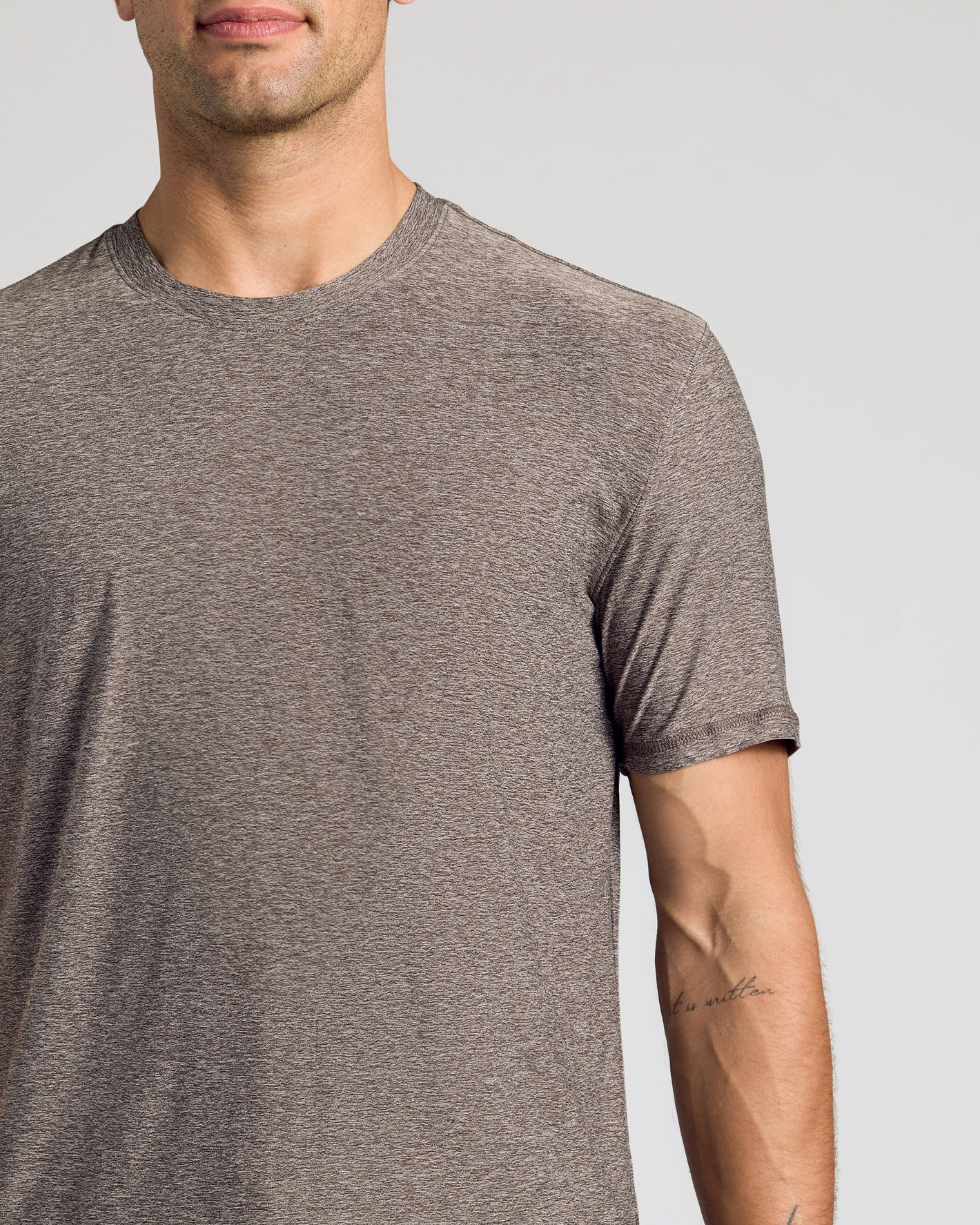 Heather Cocoa Active Crew Neck Tee on model with tattooed forearm.