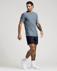 True ClassicMan in heathered blue Active Crew T-shirt and black shorts.
