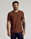 Man wearing Cedar Active Short Sleeve Crew Neck Tee with tattoos on right arm.