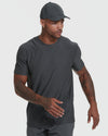 Model in charcoal-gray crew-neck tee and cap, showcasing Heather Active and Classic Crew Neck Tee 6-Pack.