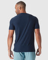 Man wearing Dark Heather Cadet Active Crew Neck Tee, back view.