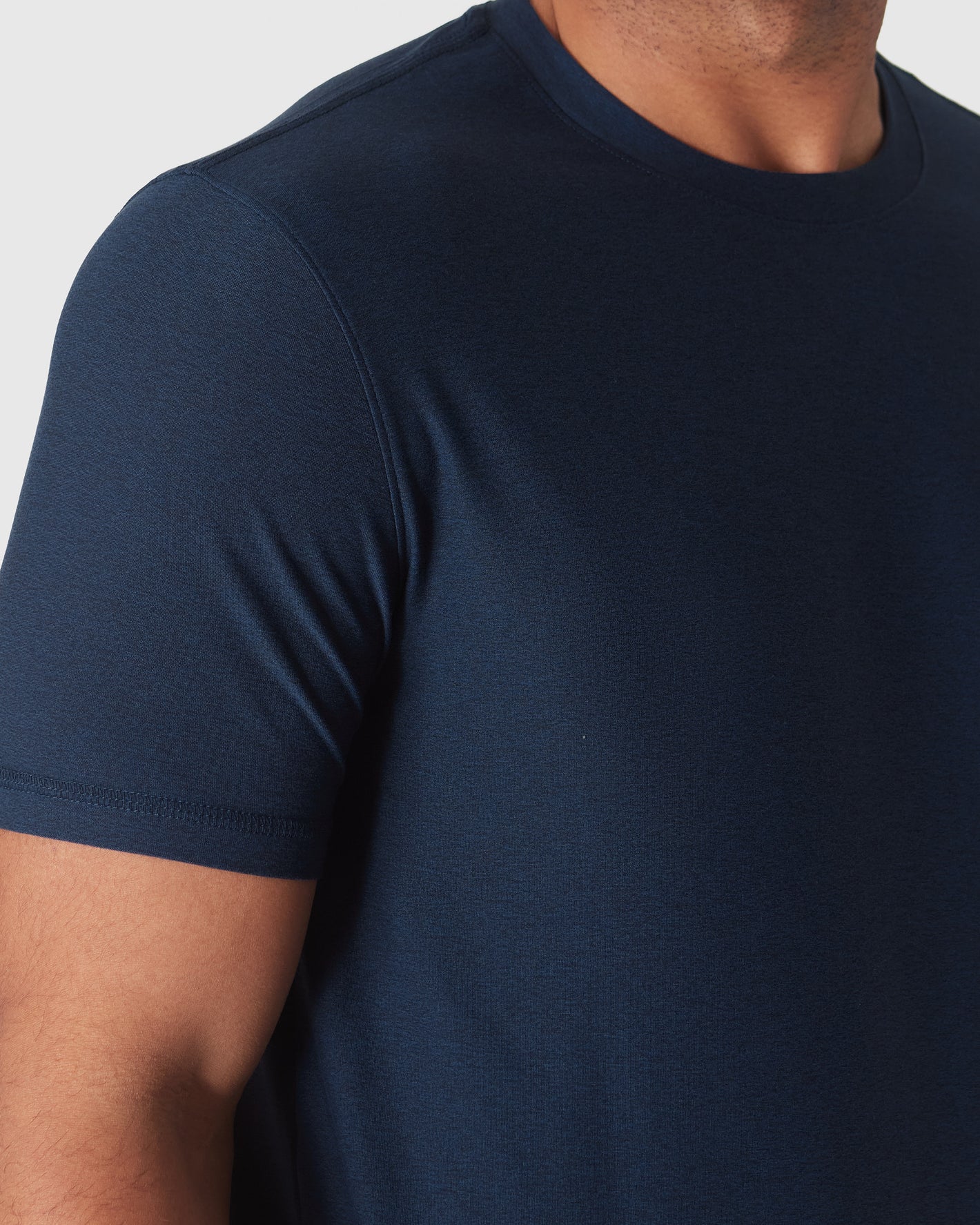 Dark Heather Cadet Active Crew Neck Tee showcasing texture and stitching details.
