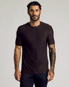 Man wears Dark Heather Cocoa Active Crew Neck Tee, showcasing tattoos.