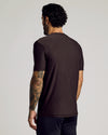 Man wearing Dark Heather Cocoa Active Crew Neck Tee, showcasing tattooed arm.