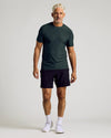 Man wearing Dark Heather Forest Active Short Sleeve Crew Neck Tee.