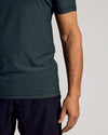 Dark Heather Forest Active Short Sleeve Crew Neck Tee worn with black bottoms.