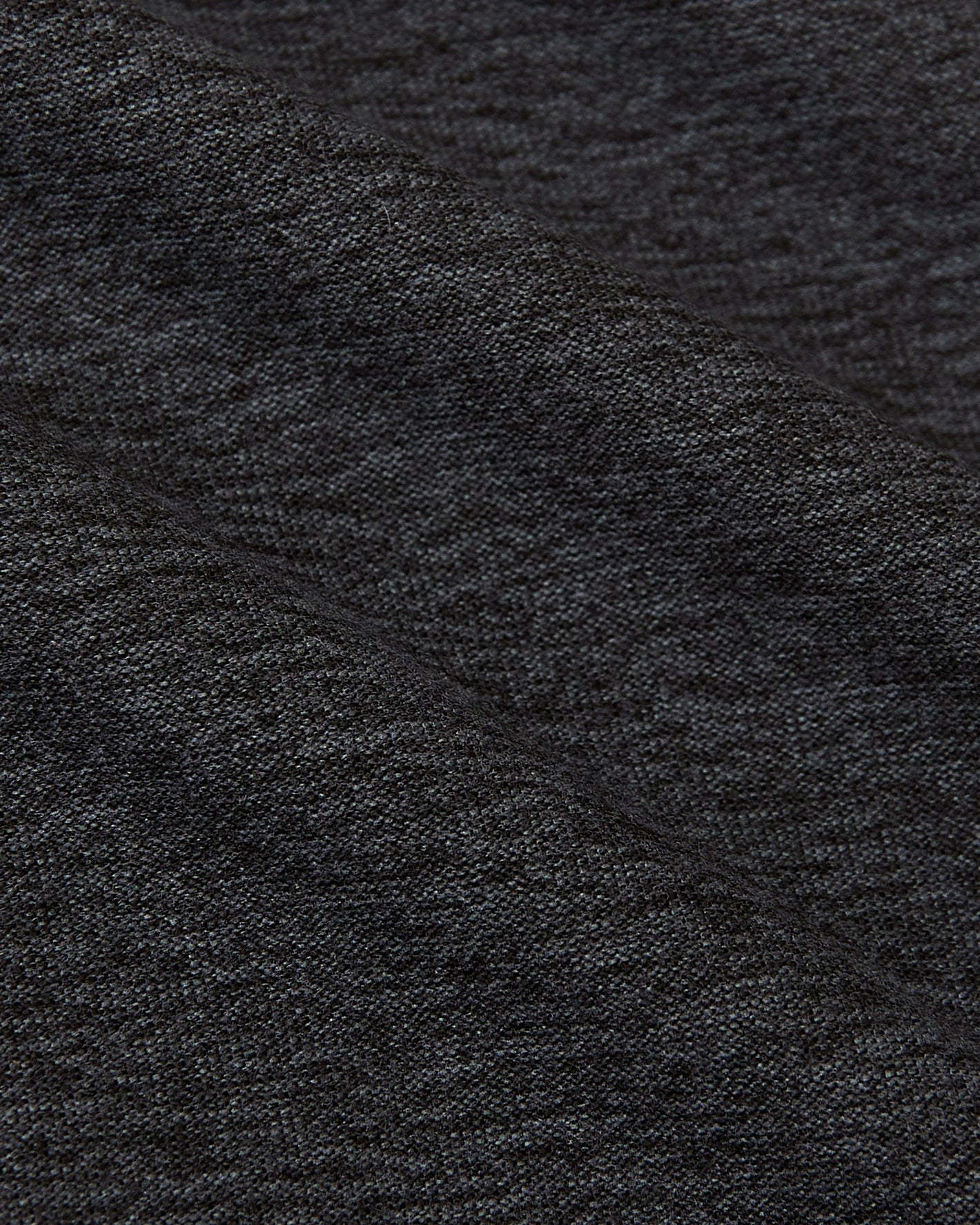 Dark Heather Tempest Active Crew Neck Tee with nubby textured fabric folds.