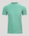 Green t-shirt on a light gray background