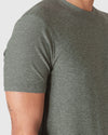Heather Forest Short Sleeve Active Crew Neck worn by a tattooed arm.