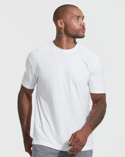 Man wearing The Versatile Crew 9-Pack T-shirt, showcasing fit and style.