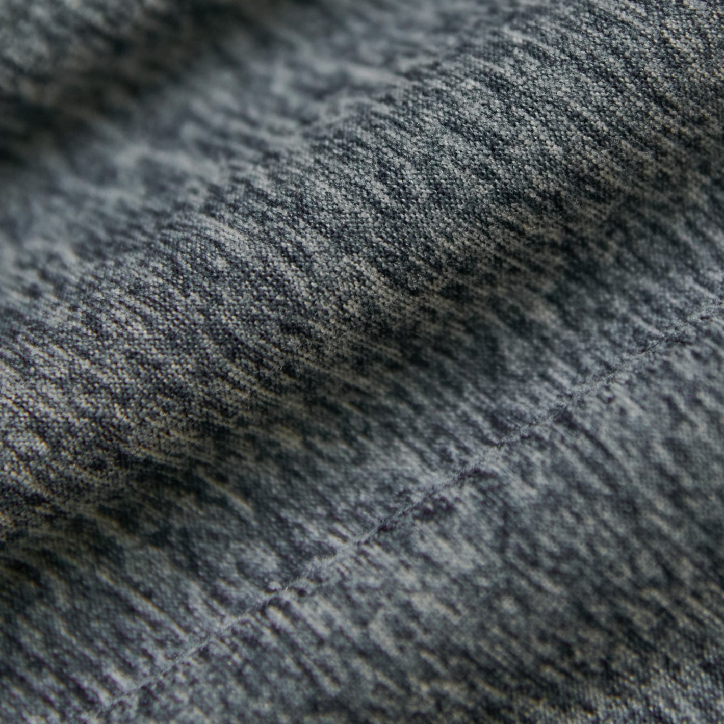 Heather Navy Short Sleeve Active Polo fabric close-up, showcasing knit texture.