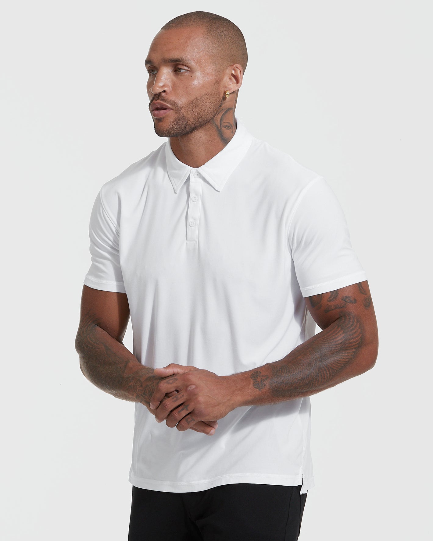 Fit model in True Classic Men’s Active Short Sleeve Polo, showcasing modern, athletic fit.