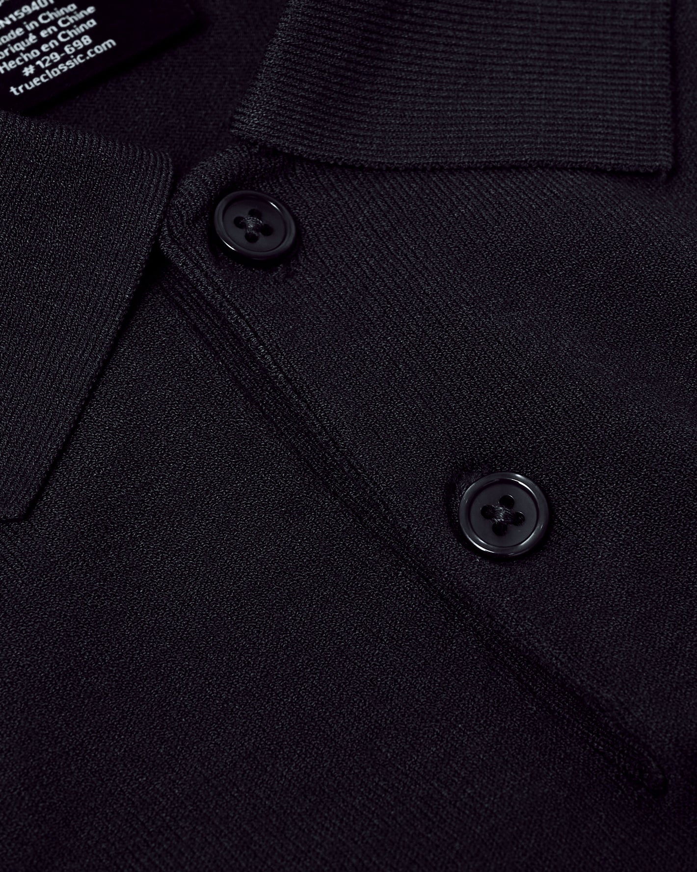 Black Short Sleeve Sweater Polo with ribbed collar and two-button placket.