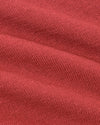 Garnet Short Sleeve Sweater Polo in textured, coral-red knit fabric.