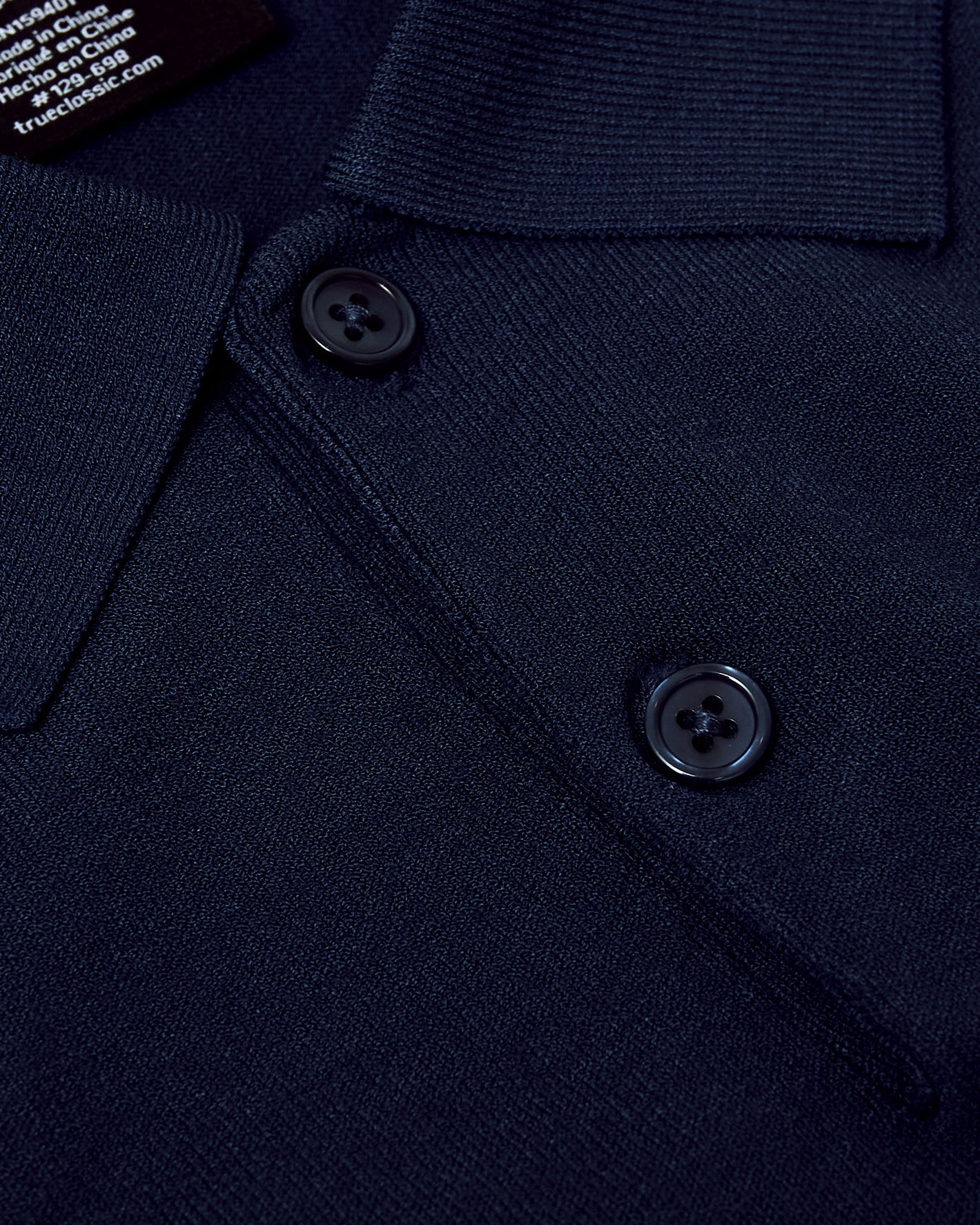 Navy Short Sleeve Sweater Polo with textured knit, button placket.