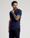 Navy Short Sleeve Sweater Polo worn by tattooed man.