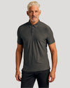 Man wearing Active Short Sleeve Polo 3-Pack in dark gray.
