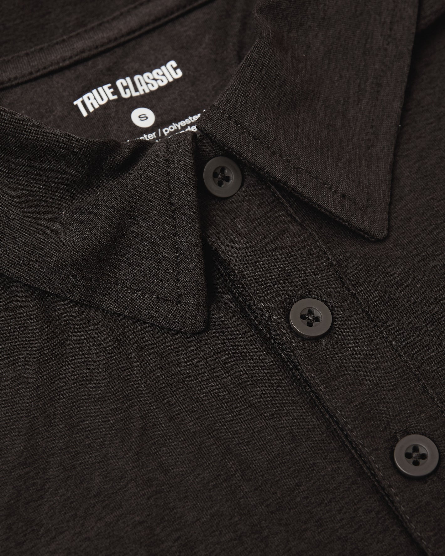 Dark Heather Cocoa Active Polo 2.0 with collar, buttons, and brand label.