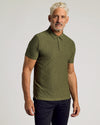 Man wearing True Classic Men’s Active Short Sleeve Polo with dark pants.