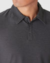 Dark Heather Tempest Active Polo 2.0, featuring a pointed collar and button placket.