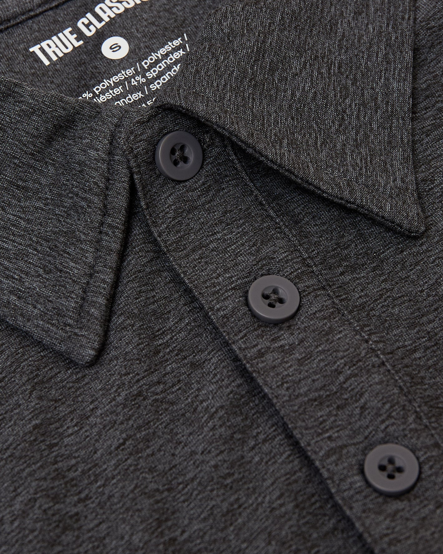 Dark Heather Tempest Active Polo 2.0, close-up of collar and buttons.
