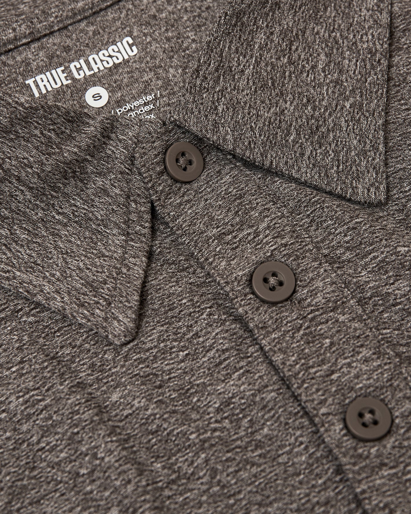 Heather Cocoa Active Polo 2.0 with collar, label, and three-button placket.