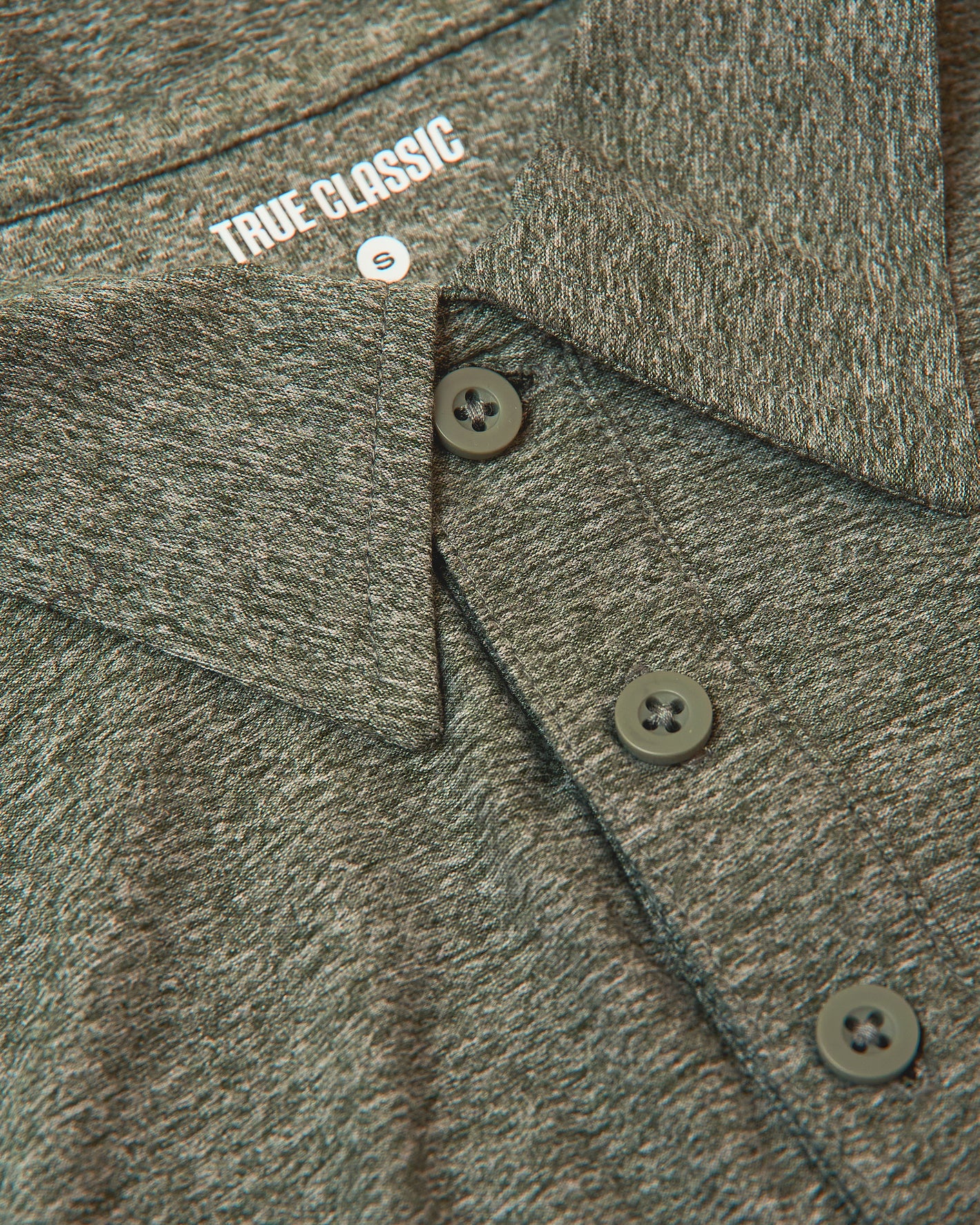 Heather-gray Active Polo 10-Pack, close-up of collar, buttons, and TRUE CLASSIC label.
