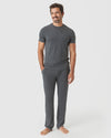 Man in Charcoal Heather Gray Short Sleeve Loungewear Tee, smiling, relaxed.