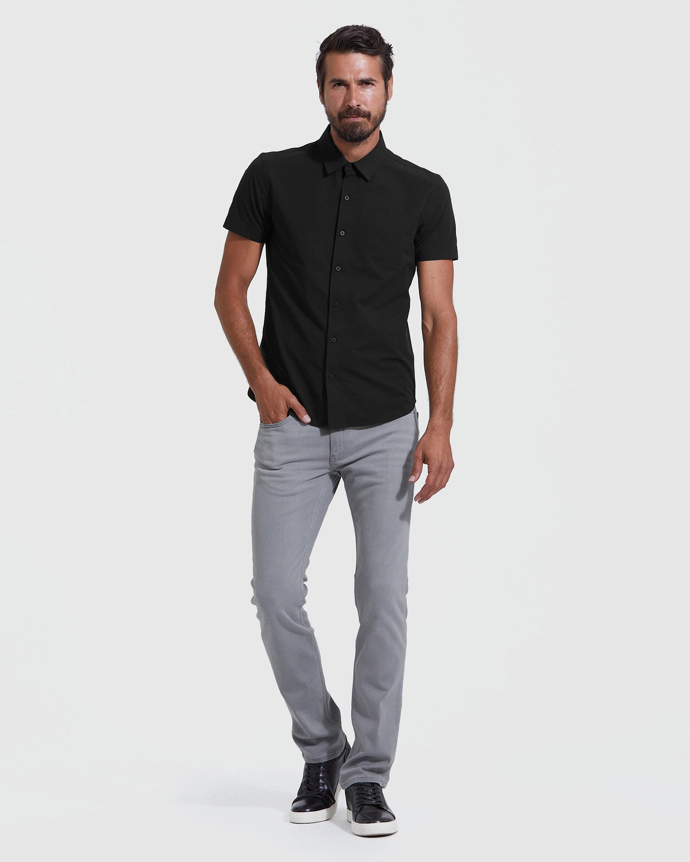 Male model in Black Short Sleeve Commuter Shirt from 3-Pack.