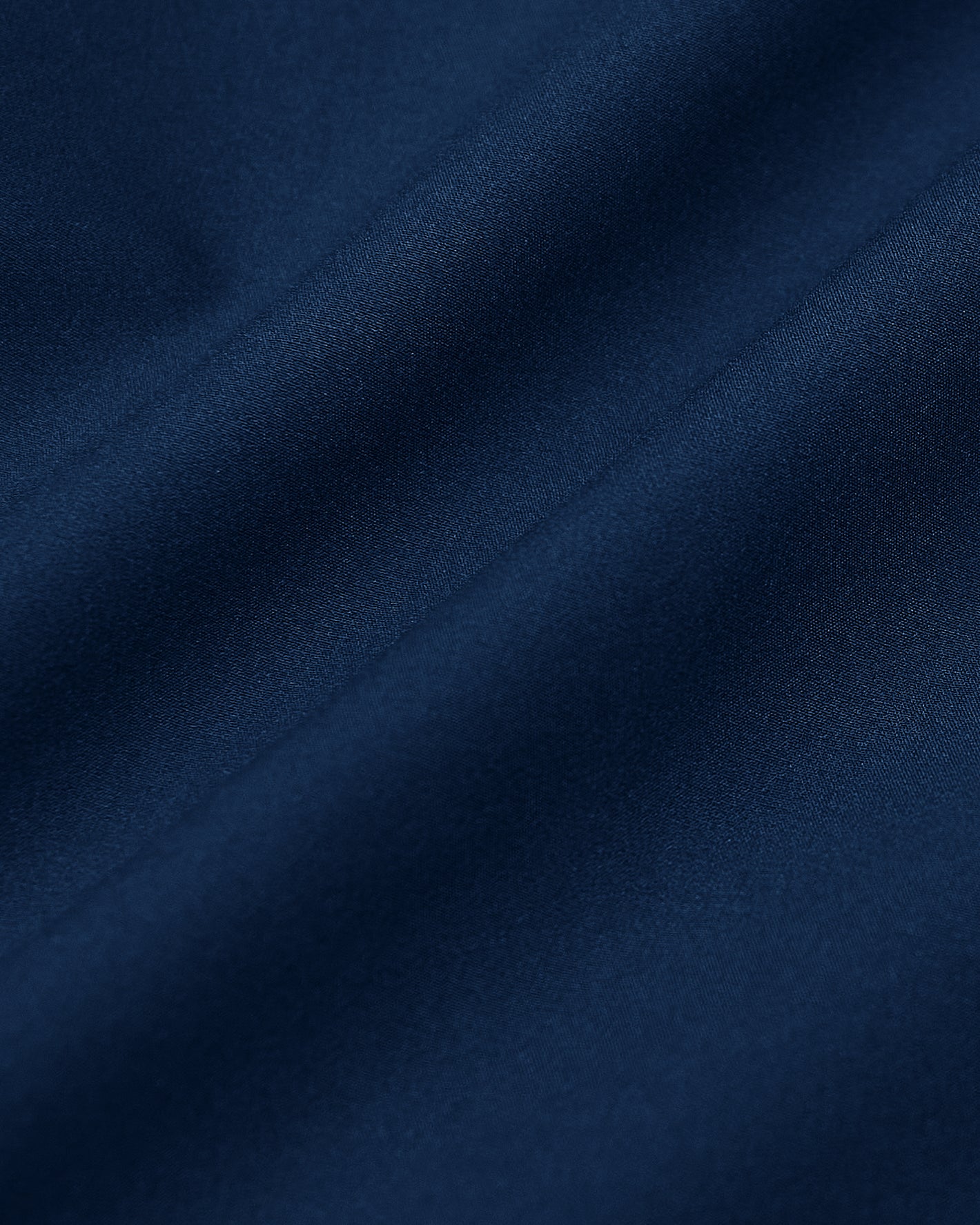 Navy Commuter Short Sleeve Shirt fabric, smooth, satiny folds.
