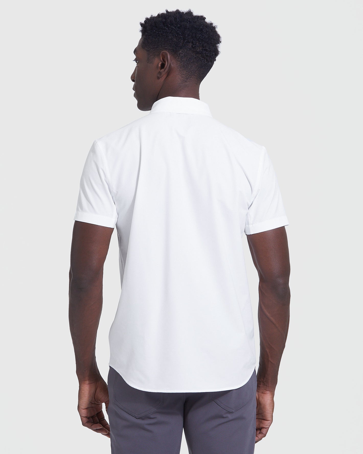 Back view of man in White Short Sleeve Commuter Shirt.