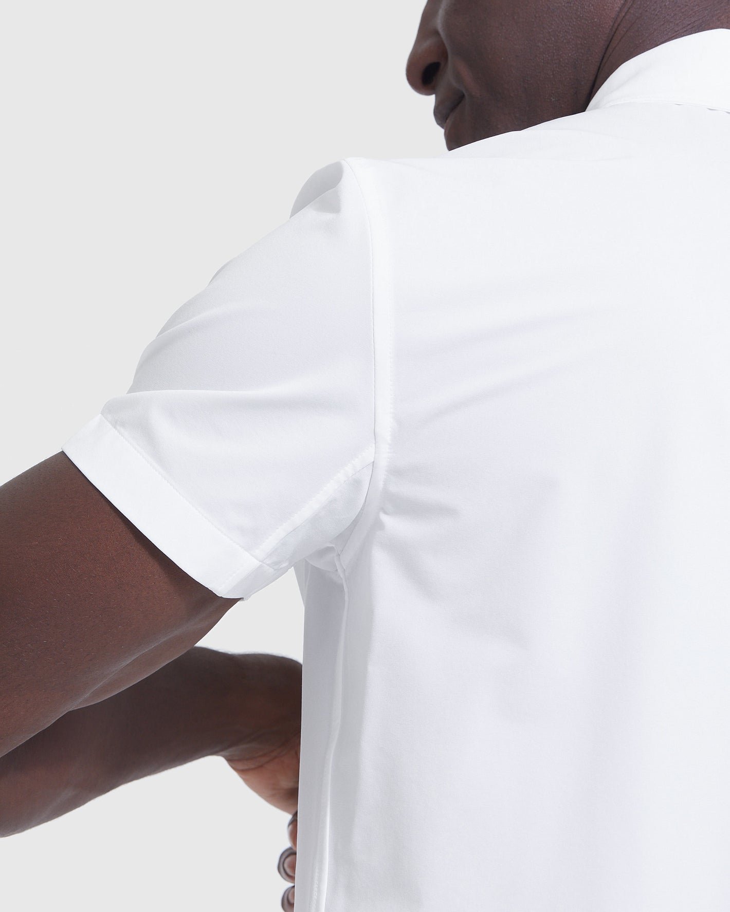 Person wearing White Short Sleeve Commuter Shirt 2-Pack from behind.