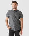 Black Wash Short Sleeve Stretch Chambray Shirt worn by man, relaxed pose.
