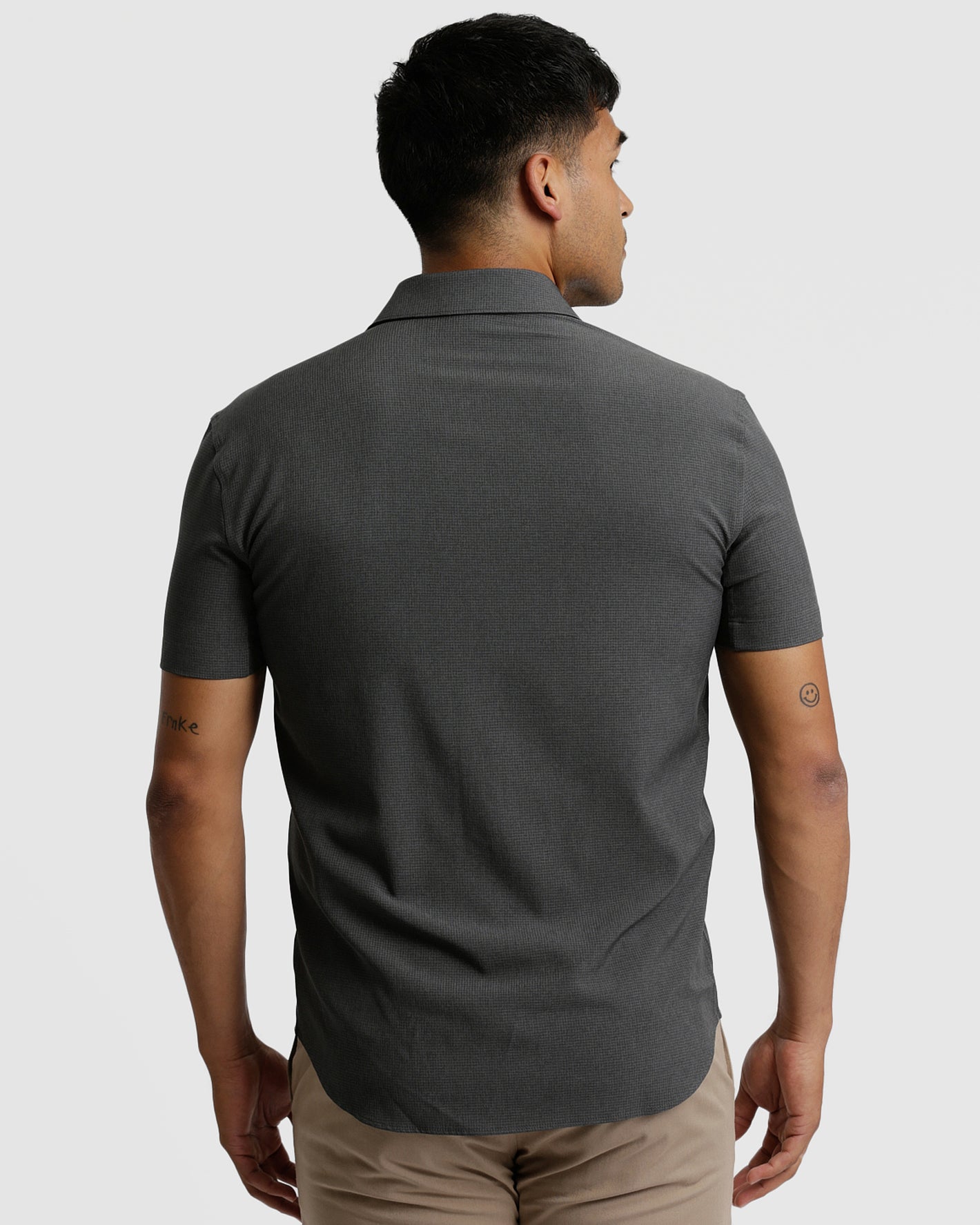 Charcoal Heather Gray Short Sleeve Ripstop Commuter Shirt on model's back.