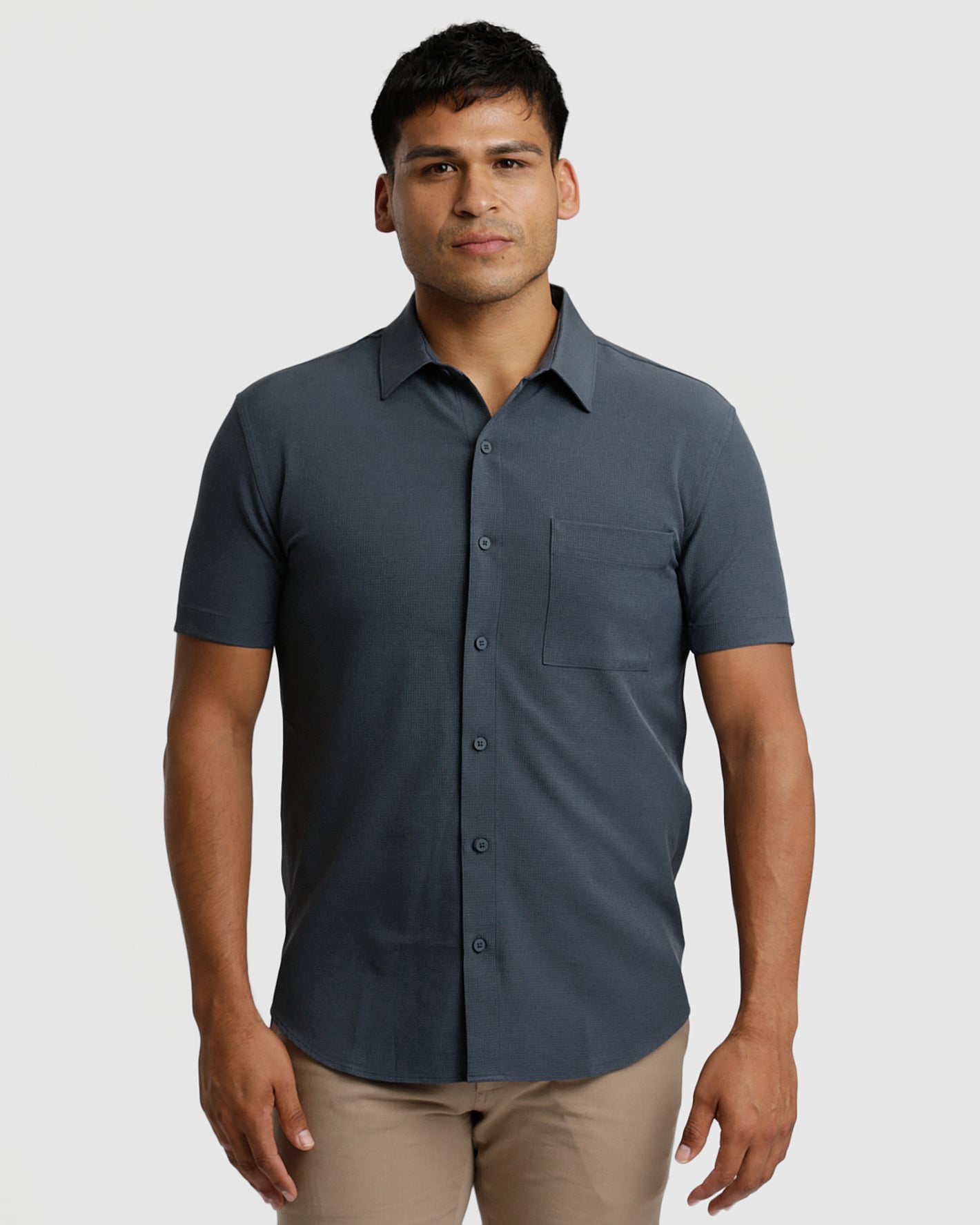 Man modeling Heather Short Sleeve Ripstop Commuter Shirt with chinos.