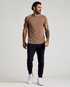Man in Alpaca Active Mesh Crew, slim joggers, white sneakers.