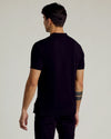 Back view of man in All Black Dressy Polo.